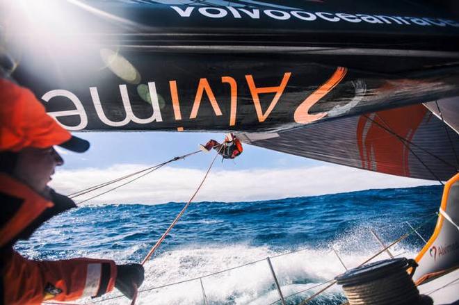 Nick Dana goes out to the clew of the Fractional Zero to add a changing sheet for an upcoming sail change,while Ryan Houston (L) tends to his tag line and acts as spotter - Leg five to Itajai -  Volvo Ocean Race 2015 ©  Amory Ross / Team Alvimedica